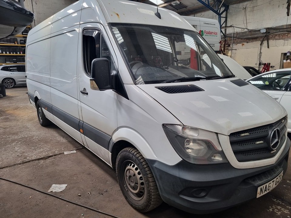 Mercedes Sprinter van with mobile AdBlue delete service technician working on the vehicle